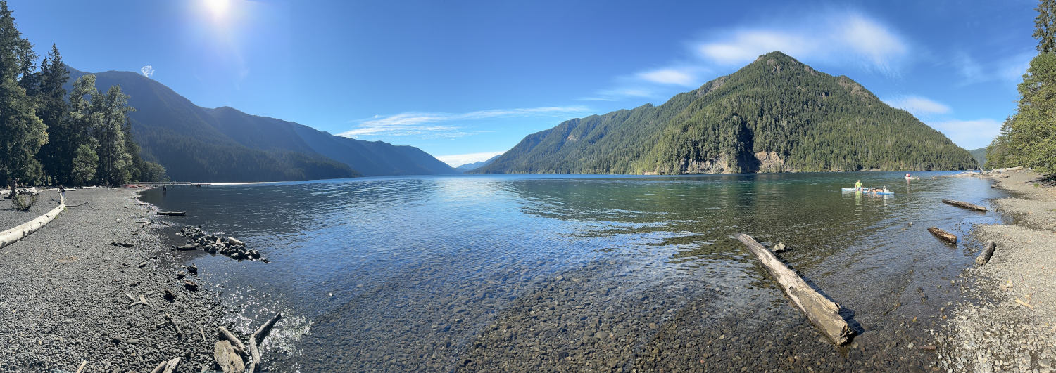 Serene lake surrounded by mountains.